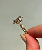 Angle view showing the light reflection on a 3 CT fancy yellow oval cut lab diamond ring with pavé halo.