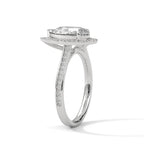 Side profile view of a 3 carat pear cut lab grown diamond halo ring in white gold with pave band
