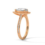 Side profile view of a 3 carat pear cut lab grown diamond ring with halo setting in rose gold