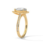 Side angle view of a 3 ct pear cut lab grown diamond halo ring in yellow gold with pave diamonds