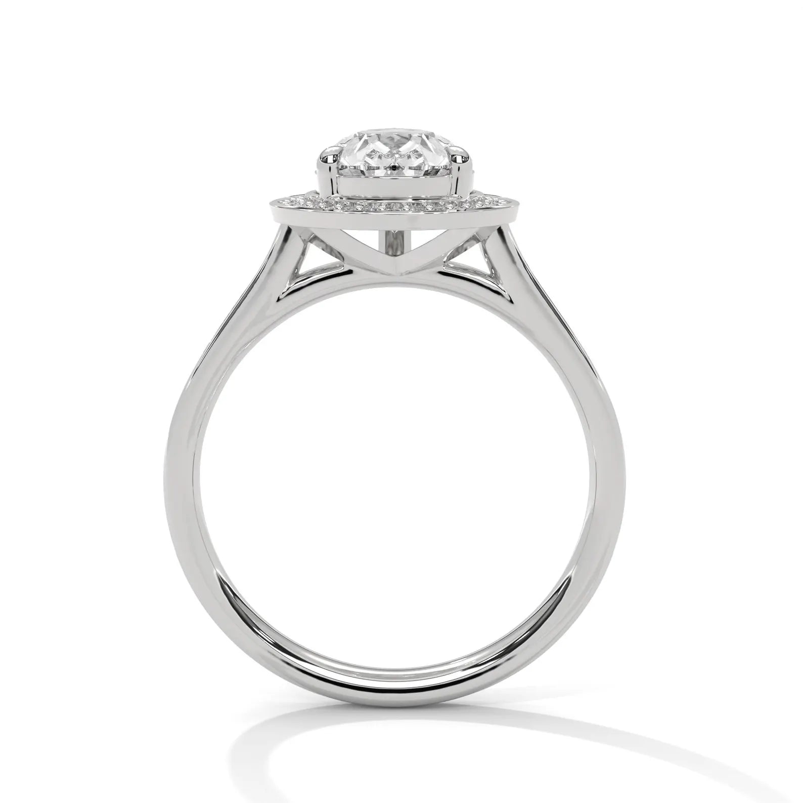 Profile view showing the basket and band structure of a white gold pear halo engagement ring