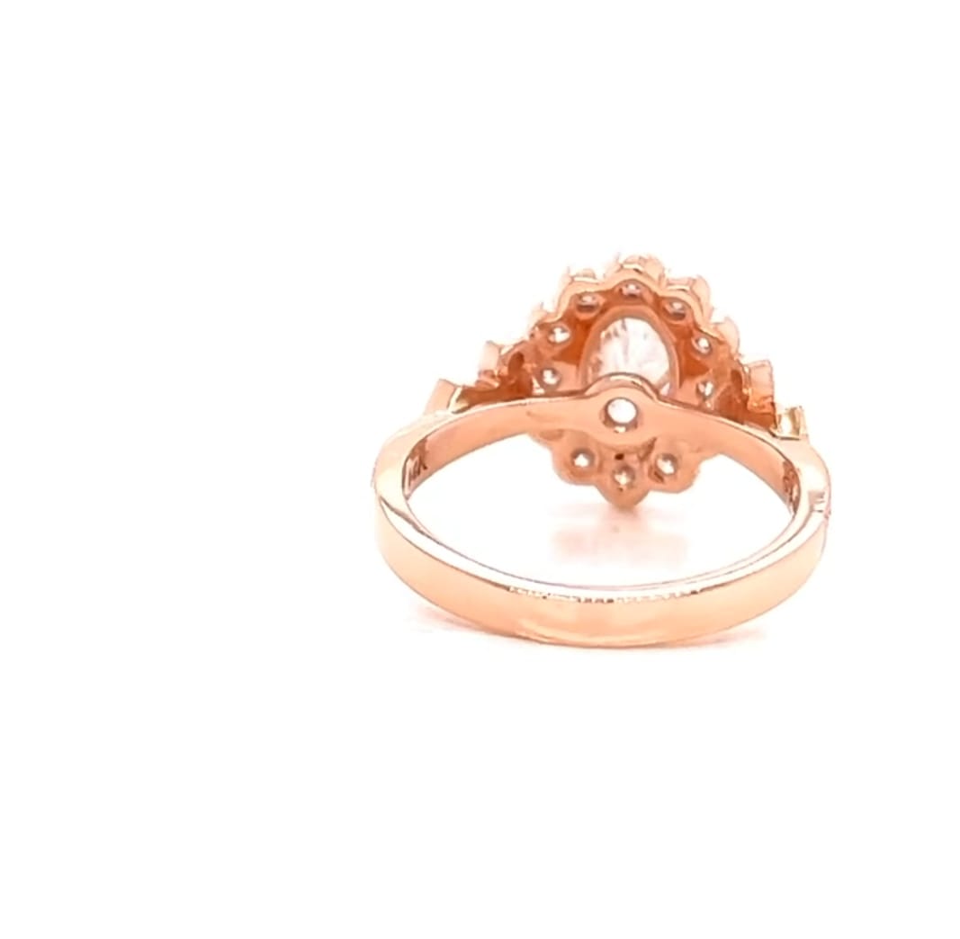 Underside profile view displaying the basket gallery structure of a rose gold oval halo engagement ring
