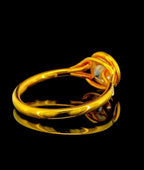 Back band view showing the smooth yellow gold shank and split shoulder setting of a round lab diamond ring