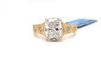 Front view of a 3 carat elongated cushion cut lab grown diamond ring with hand-engraved yellow gold band