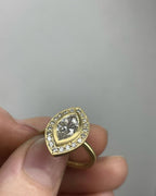 Front view of a vintage-inspired 3 CT marquise cut lab diamond ring held in hand
