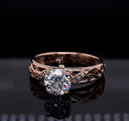 Close up front angle showing light refraction of a 2 carat round lab diamond in rose gold