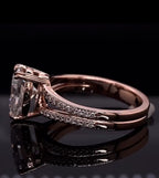 Clear profile view displaying the solid shank base, split pave band, and prong setting of the pear diamond ring