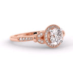 Side profile of a 3 carat round lab grown diamond halo engagement ring in rose gold showing milgrain and leaf accents.