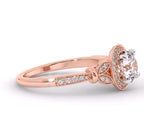Perspective view of a rose gold lab grown diamond engagement ring with paved band and vintage details.