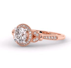 Angled front view of 3 CT round lab diamond ring featuring leaf side motifs and pave diamond halo in rose gold.