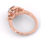 Under-gallery side angle showing structural prong craft and setting design of a rose gold halo ring.
