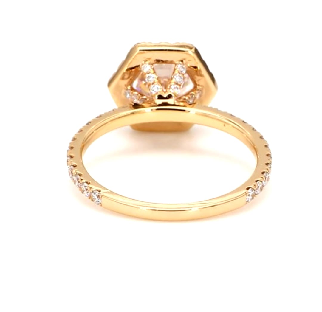 Under-gallery detail of a round lab grown diamond ring with diamond accents and gold band.