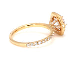 Side view showing the pave set diamond band and structural basket setting of the engagement ring.