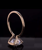 Upside-down profile shot highlighting the sleek half-bezel gold basket and cushion diamond pavilion.