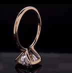 Standing view showing the open side profile and cushion cut facet structure of the lab diamond.