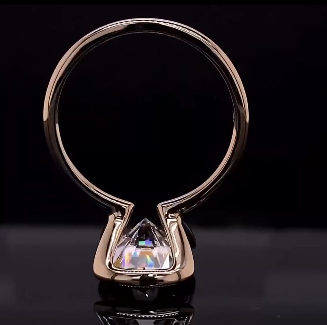 Direct under-gallery view detailing the precision metalwork of the half-bezel solitaire frame.
