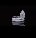 Slightly angled view highlighting the multi-row pave diamond bypass band on white gold setting.
