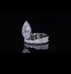 Side view showing the elevated pear-shaped halo setting and brilliant pave detailing.
