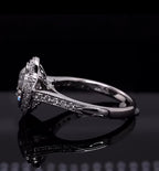 Profile view of a vintage-style bezel set diamond engagement ring highlighting the gallery and shoulder design.