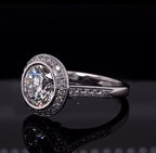 Angled view of a stunning 3 CT round lab diamond ring showing the intricate diamond-studded white gold band.