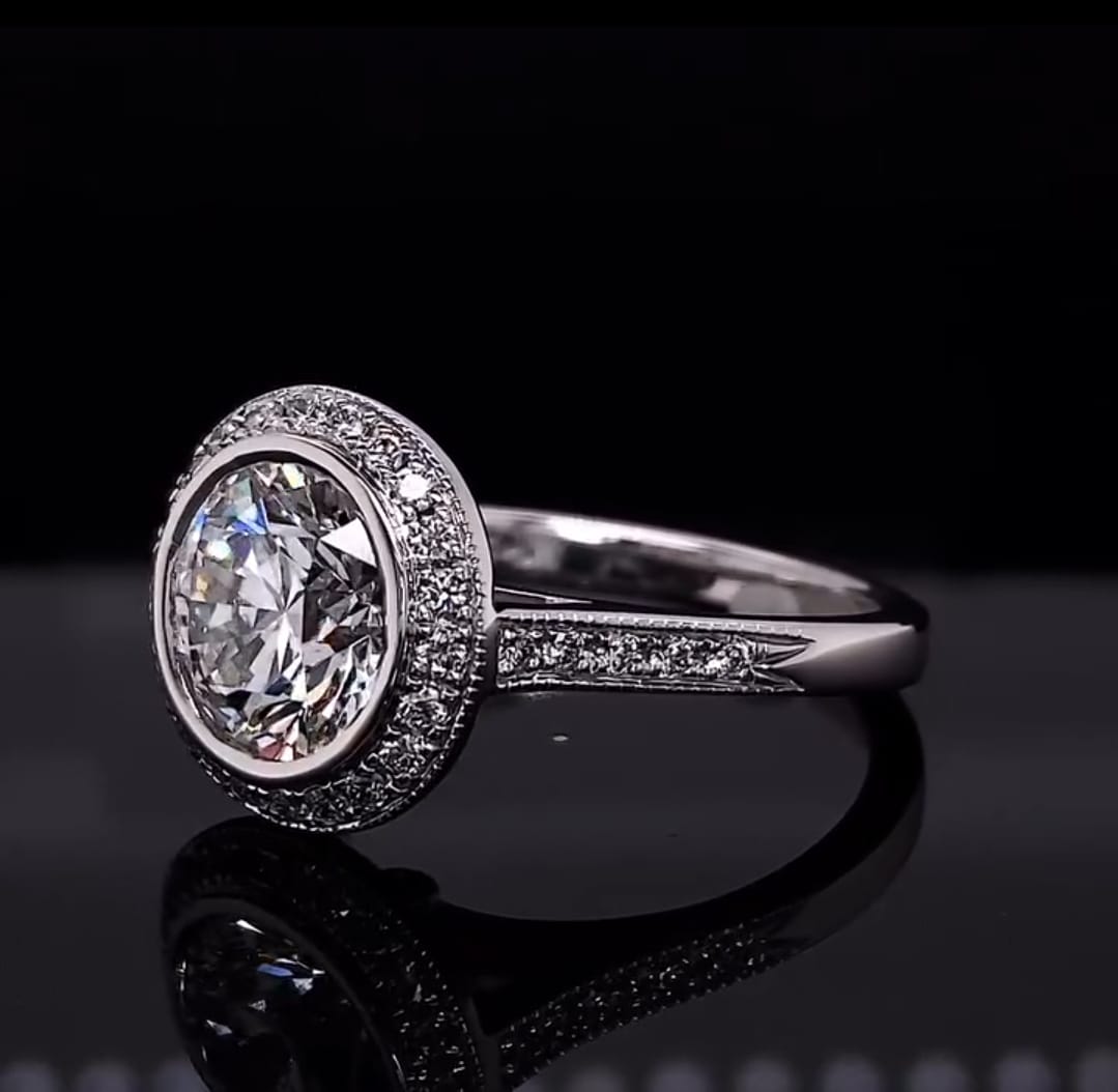 Angled view of a stunning 3 CT round lab diamond ring showing the intricate diamond-studded white gold band.