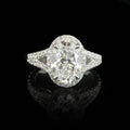 Direct top view of a brilliant 2 CT oval cut lab grown diamond engagement ring with a split shank setting.