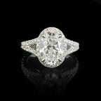 Direct top view of a brilliant 2 CT oval cut lab grown diamond engagement ring with a split shank setting.
