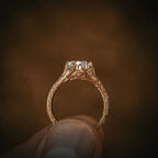 Side profile view of a 2 CT pear cut lab grown diamond ring featuring a uniquely textured twig-style gold band.