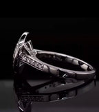 Side profile view of a white metal engagement ring showcasing the structured under-gallery and elevated bezel setting of a 3 ct oval lab diamond.