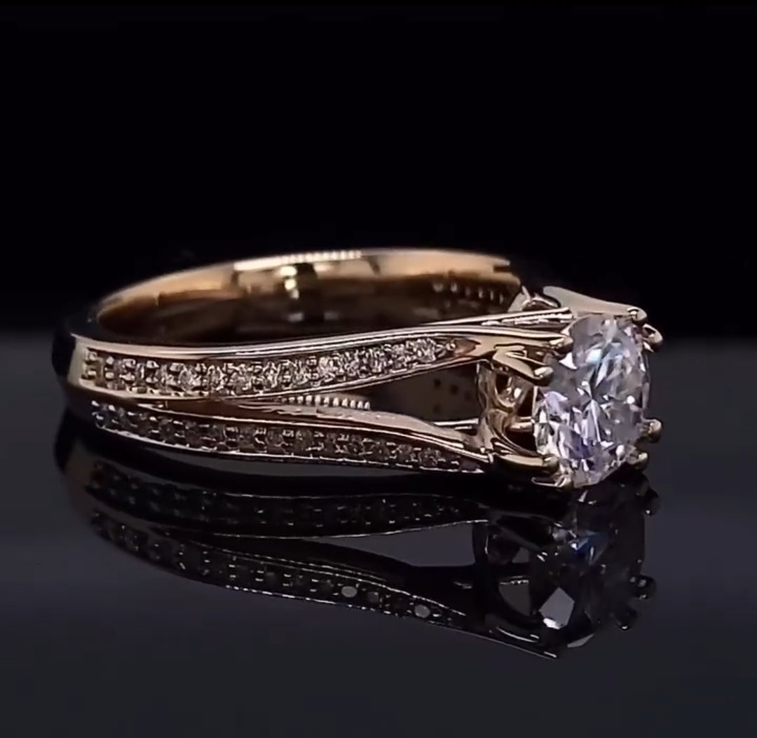 Angled top view showcasing the round center diamond and the intricate twisted split band design encrusted with smaller diamonds.