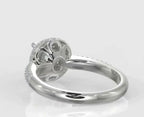 Angled rear profile highlighting the intricate scalloped undercarriage and diamond pavé details of a halo engagement ring.
