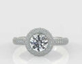 Top-down view of a stunning 3 carat round cut lab created diamond surrounded by a dazzling pavé halo and diamond shank.