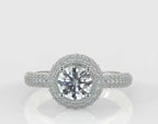 Top-down view of a stunning 3 carat round cut lab created diamond surrounded by a dazzling pavé halo and diamond shank.