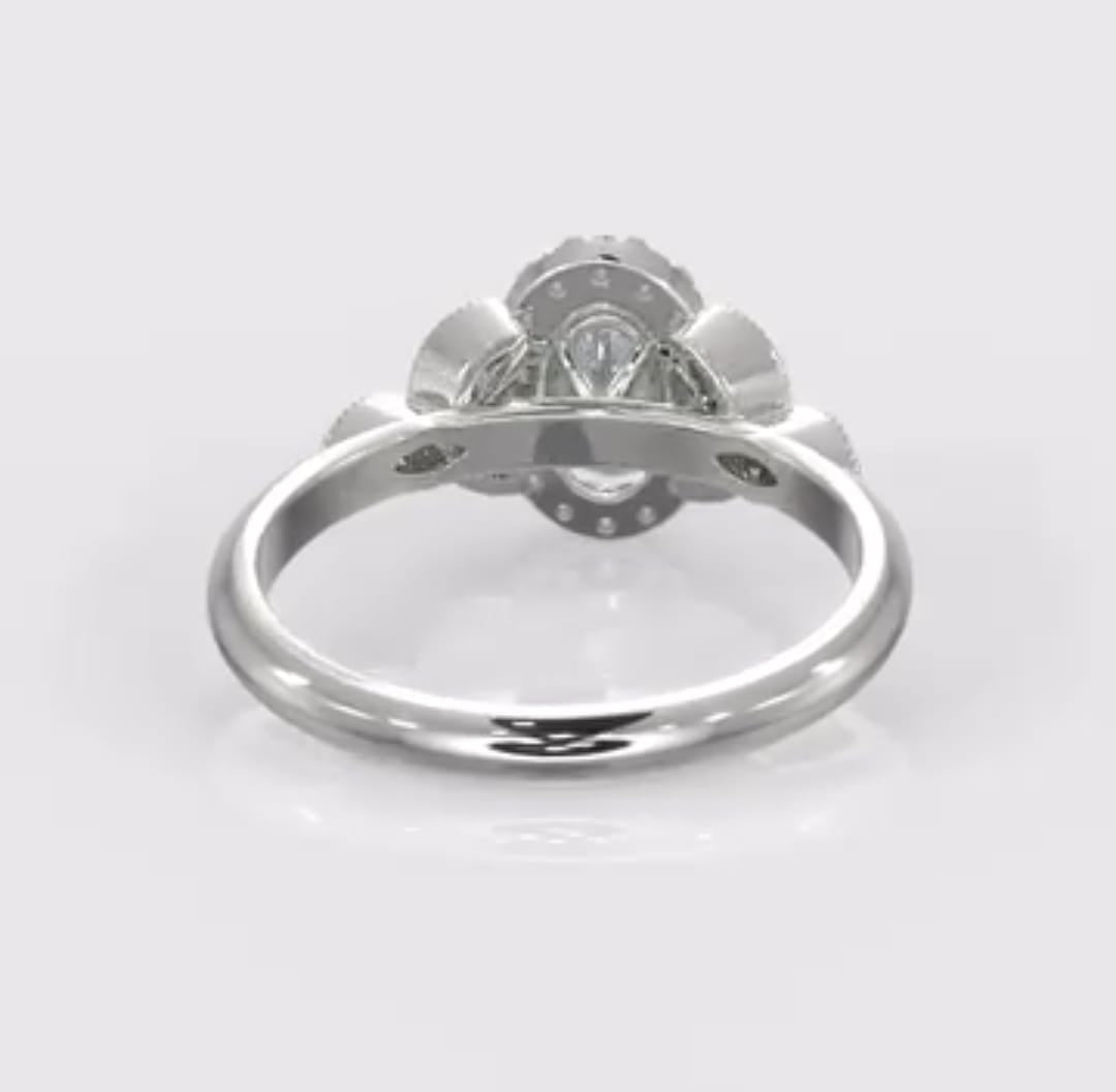 Rear view of a 2 carat oval cut lab grown diamond ring showcasing the polished white metal band and the secure undercarriage of the halo setting.