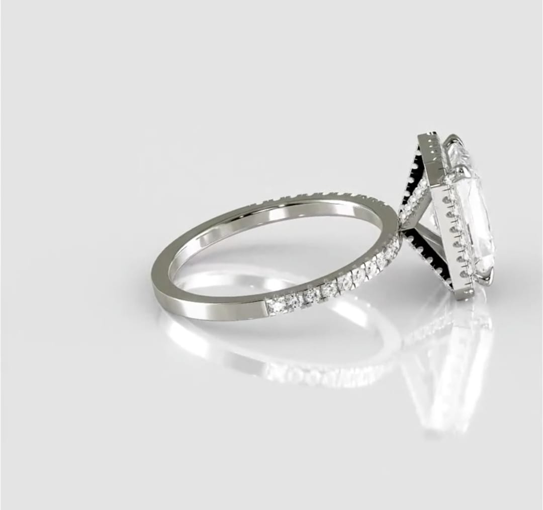 Side profile view of a 3 carat radiant cut lab grown diamond ring with a pavé diamond band and distinctive diamond-encrusted under-gallery on a white background.