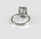 Lower angle view focusing on the unique diamond-studded V-shaped cross gallery beneath the 3 carat radiant center stone.