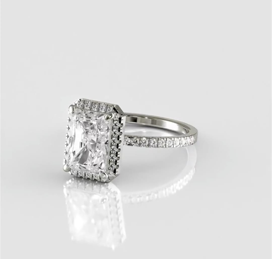 Three-quarter top view of the 3 carat radiant cut lab grown diamond showing its bright crushed-ice sparkle, halo, and thin pavé band.