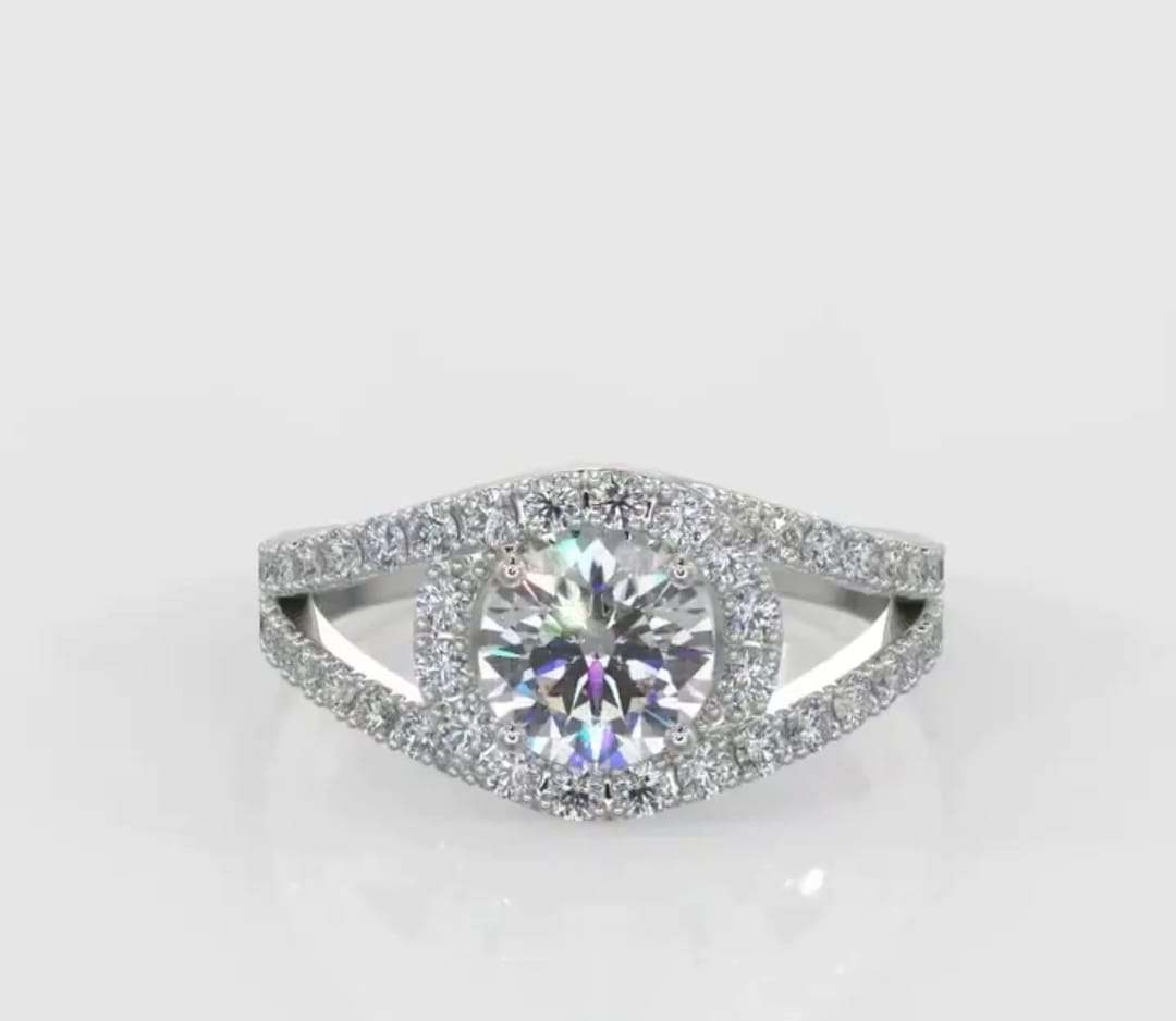 Direct top-down view of a brilliant 2 carat round cut lab grown diamond ring with a sweeping split shank halo design.