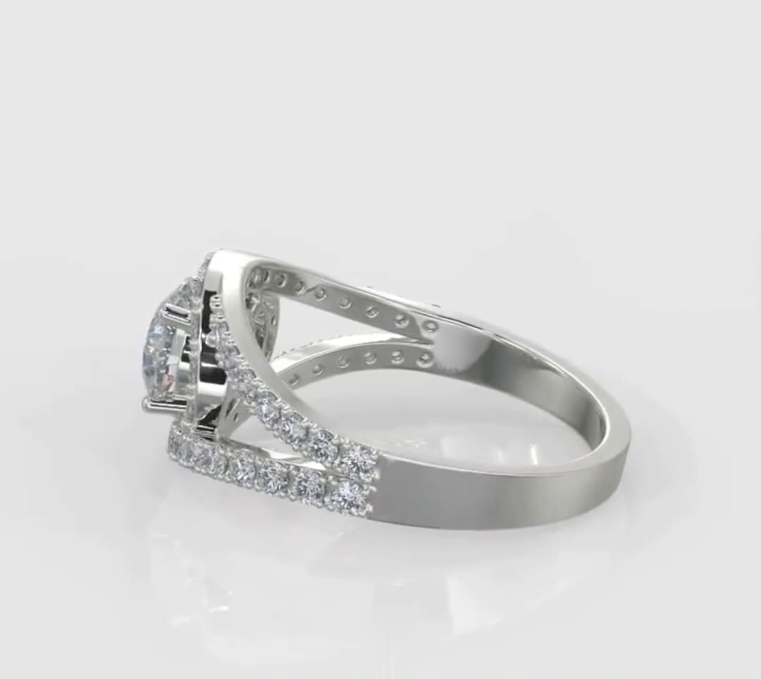 Side angle view of a silver or white gold lab grown diamond engagement ring showing the structural arches of the pave split shank.