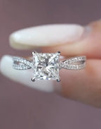 Top-down view of a brilliant 2 CT princess cut diamond engagement ring featuring a sparkling, intertwined twisted split shank.