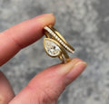 Angled close-up of the 2 Carat Pear Cut Lab Grown Diamond ring highlighting the brilliant center stone and pavé accents.