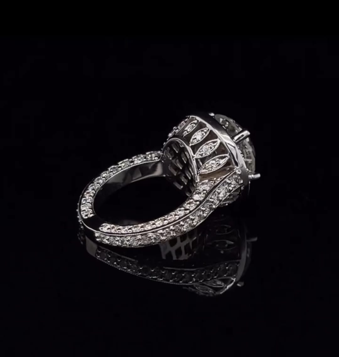 Side view showing the detailed marquise-motif basket of a 3 carat round lab grown diamond halo ring.