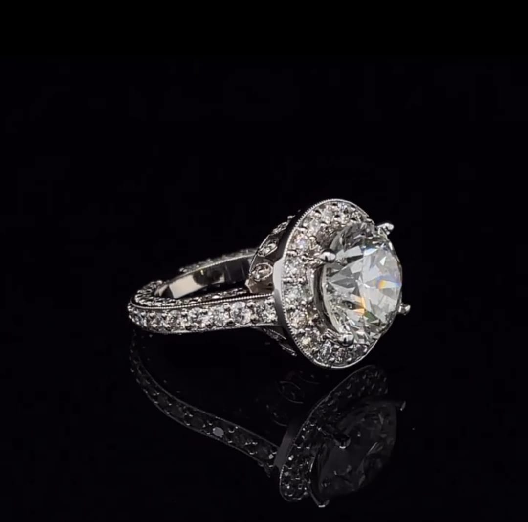 Angled side view highlighting the brilliance of the 3 CT round cut lab grown diamond and halo frame.