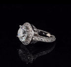 Side angle displaying the milgrain edging and pave setting on a 3 carat lab created diamond ring.