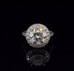 Top-down view showing a sparkling 3 carat round brilliant lab grown diamond encircled by a micro-pave halo.