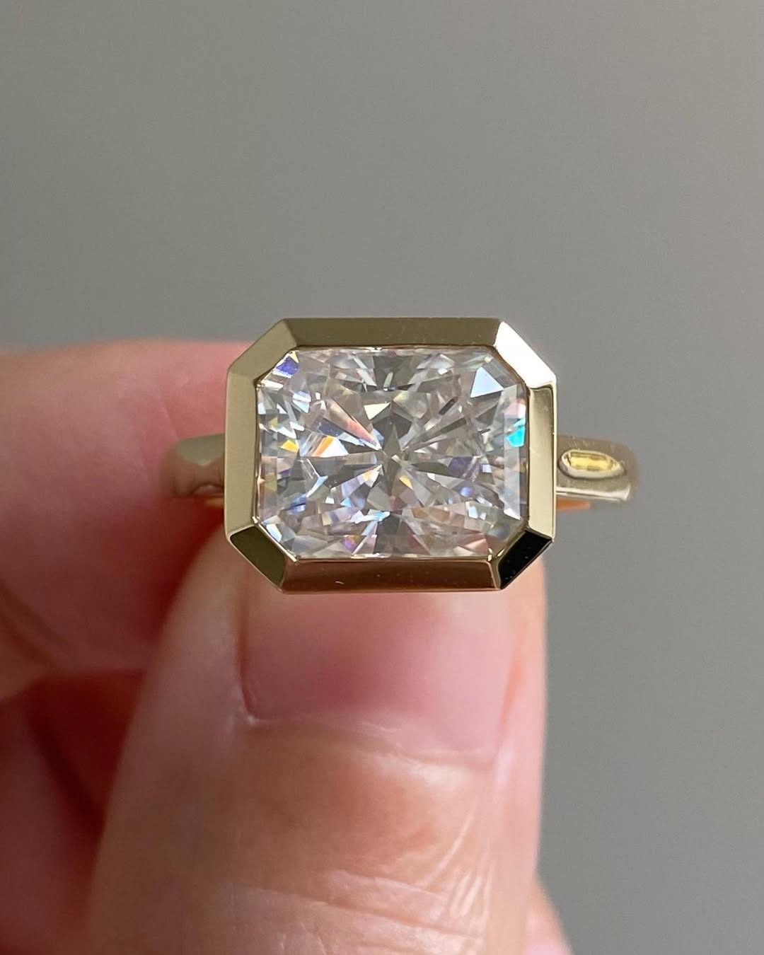 Front view highlighting the brilliant sparkle of a horizontally set 3 CT radiant cut lab grown diamond.