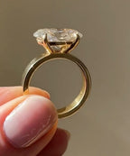Side profile of 2 CT oval lab grown diamond ring with 4-prong setting in 18k yellow gold