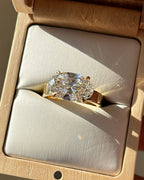 2 CT oval lab created diamond solitaire ring set horizontally in a luxury wooden ring box