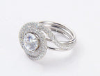 Side angle view showing multi-strand white gold band on a 2 carat round lab diamond ring