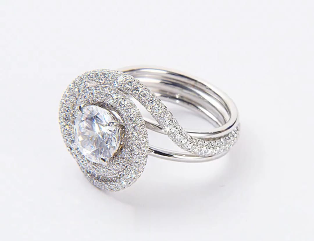 Side angle view showing multi-strand white gold band on a 2 carat round lab diamond ring